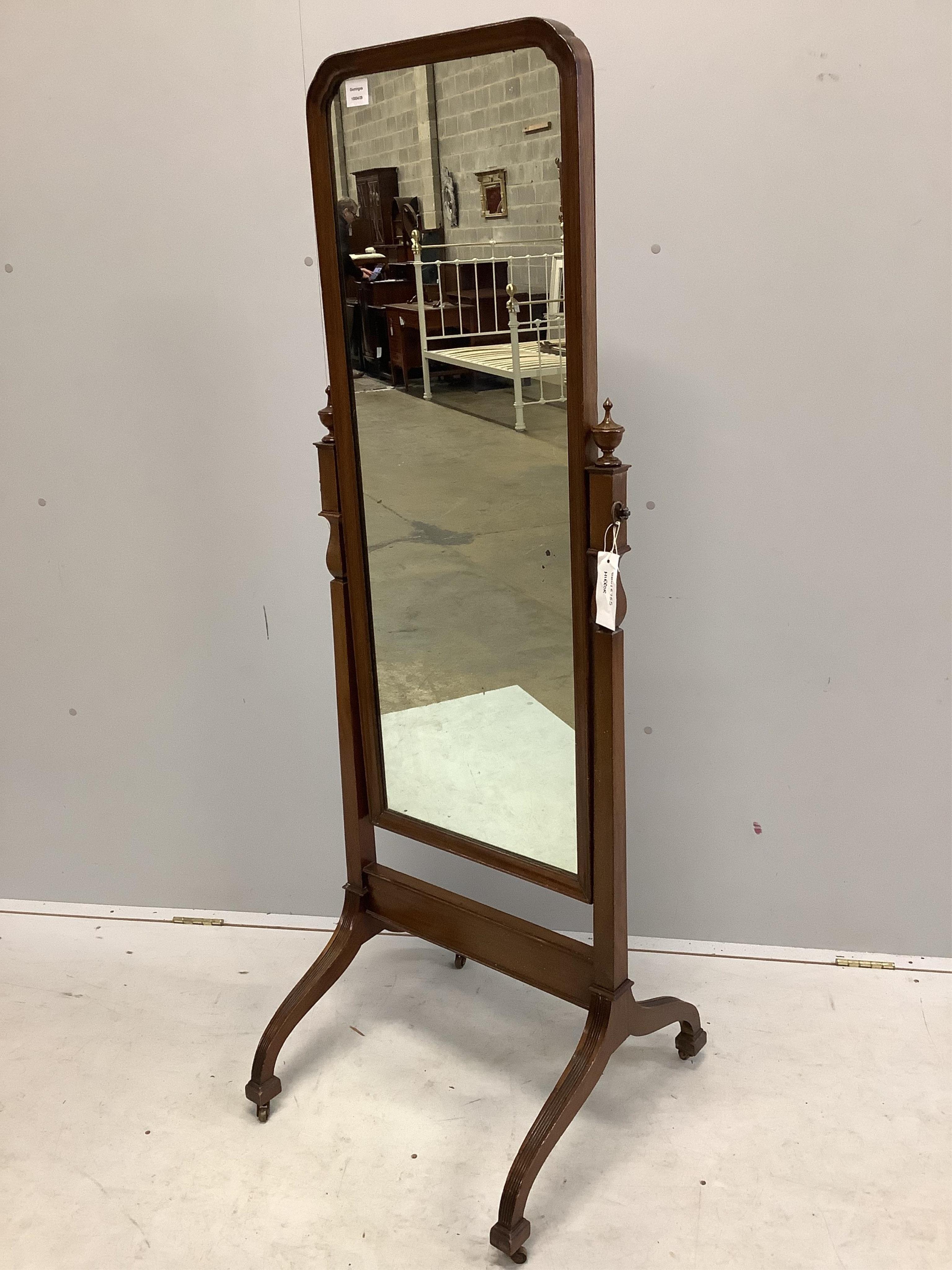 An early 20th century mahogany cheval mirror on fluted down swept feet, width 54cm, height 158cm. Condition - fair to good